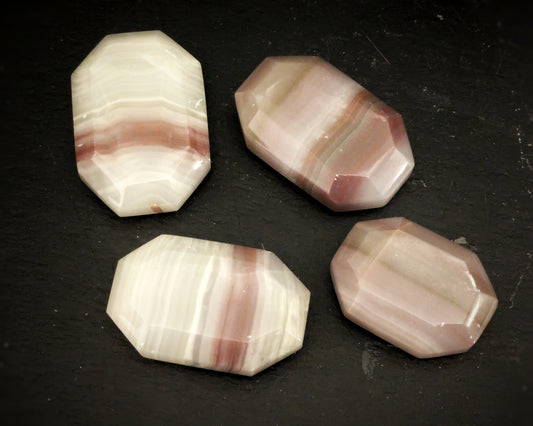 Pink Banded Onyx Faceted Palmstone 1